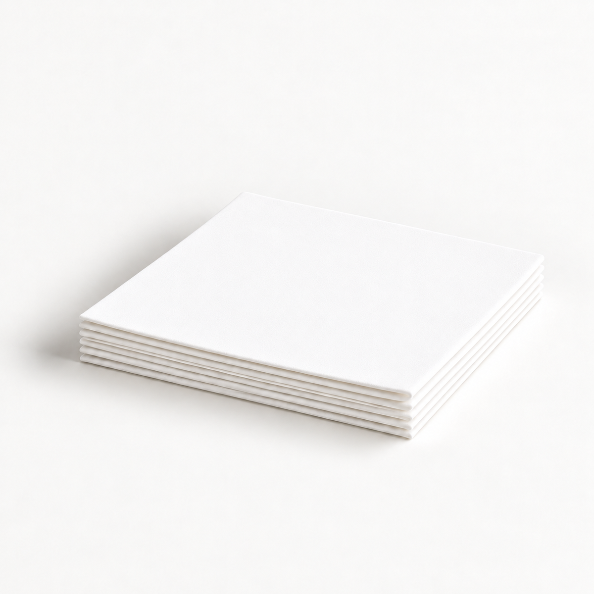 Thin white Krystal Klear pressed microfiber cloths folded in a flat stack