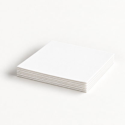 Thin white Krystal Klear pressed microfiber cloths folded in a flat stack